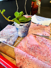 Load image into Gallery viewer, Finished marbled papers drying on a rack, exemplifying the beautiful results achievable with the DIY Paper Marbling Kit.
