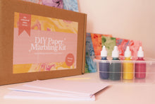 Load image into Gallery viewer, Close up of the packaging of DIY Paper Marbling kit, making it the perfect gift to give for the creative person in your life
